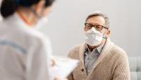 Male patient consulting with doctor